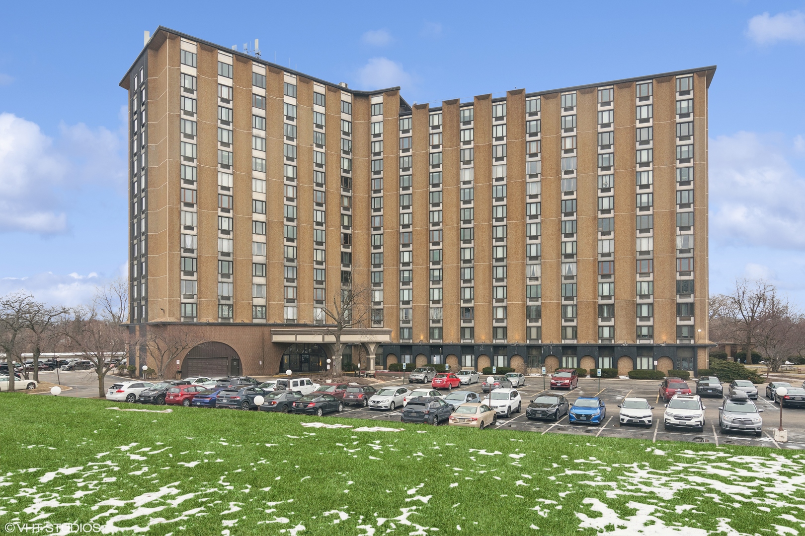 a front view of a building with outdoor space