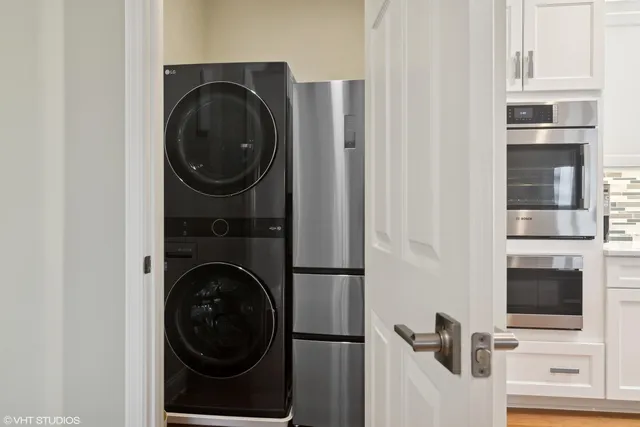 a view of a kitchen with a washer and dryer