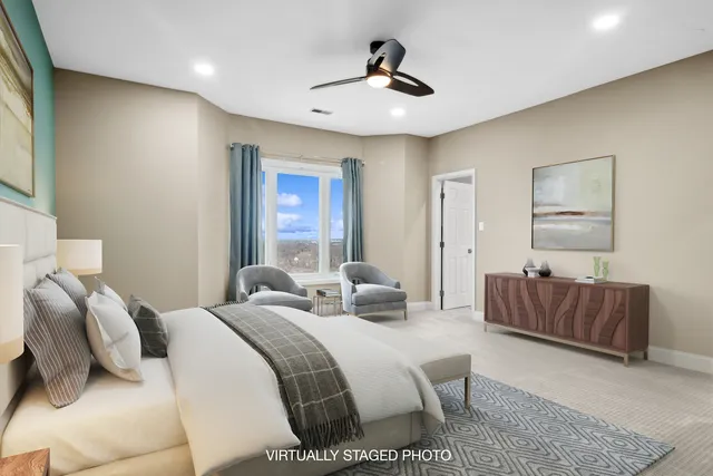 a bedroom with a bed and a couch