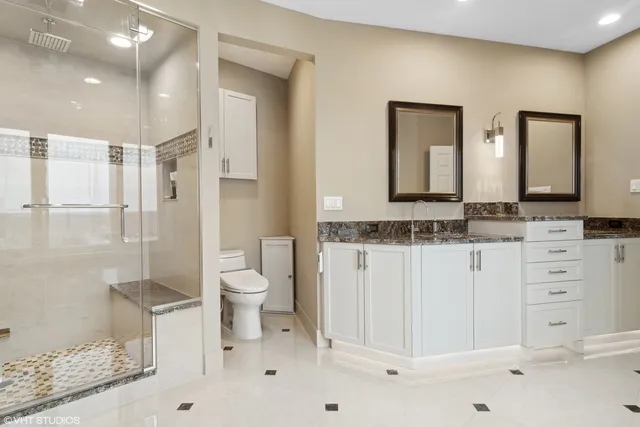 a bathroom with a double vanity sink and mirror