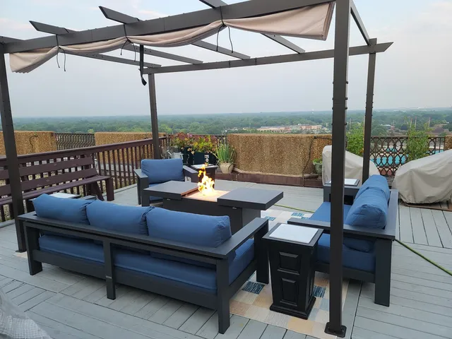 an aerial view of a house with a swimming pool and garden