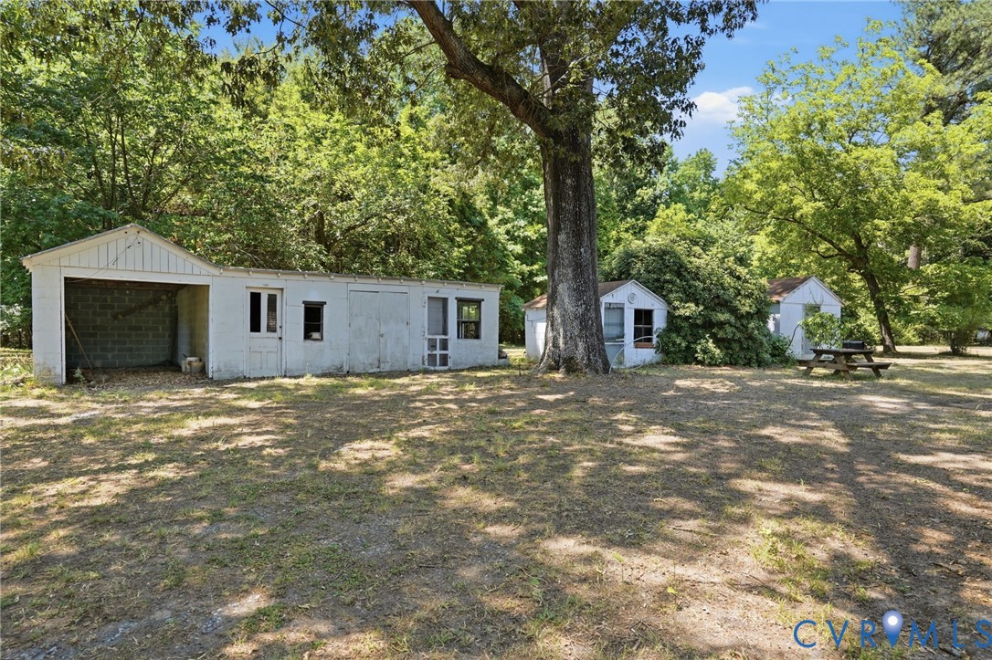 2350 Chelsea Road West Point, VA 23181 - Photo 6 of 34 a view of a house with backyard and a tree