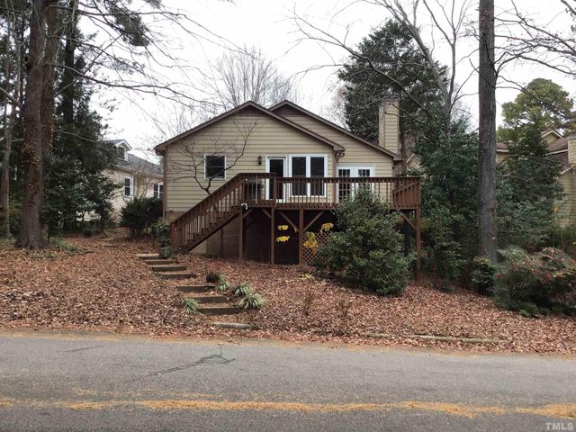 a view of a house with a yard covered in snow