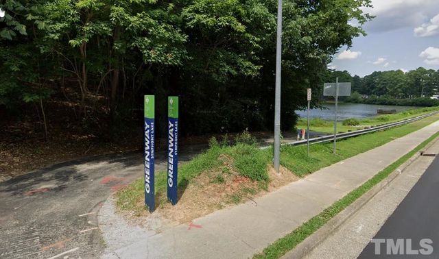 a view of a park with large trees