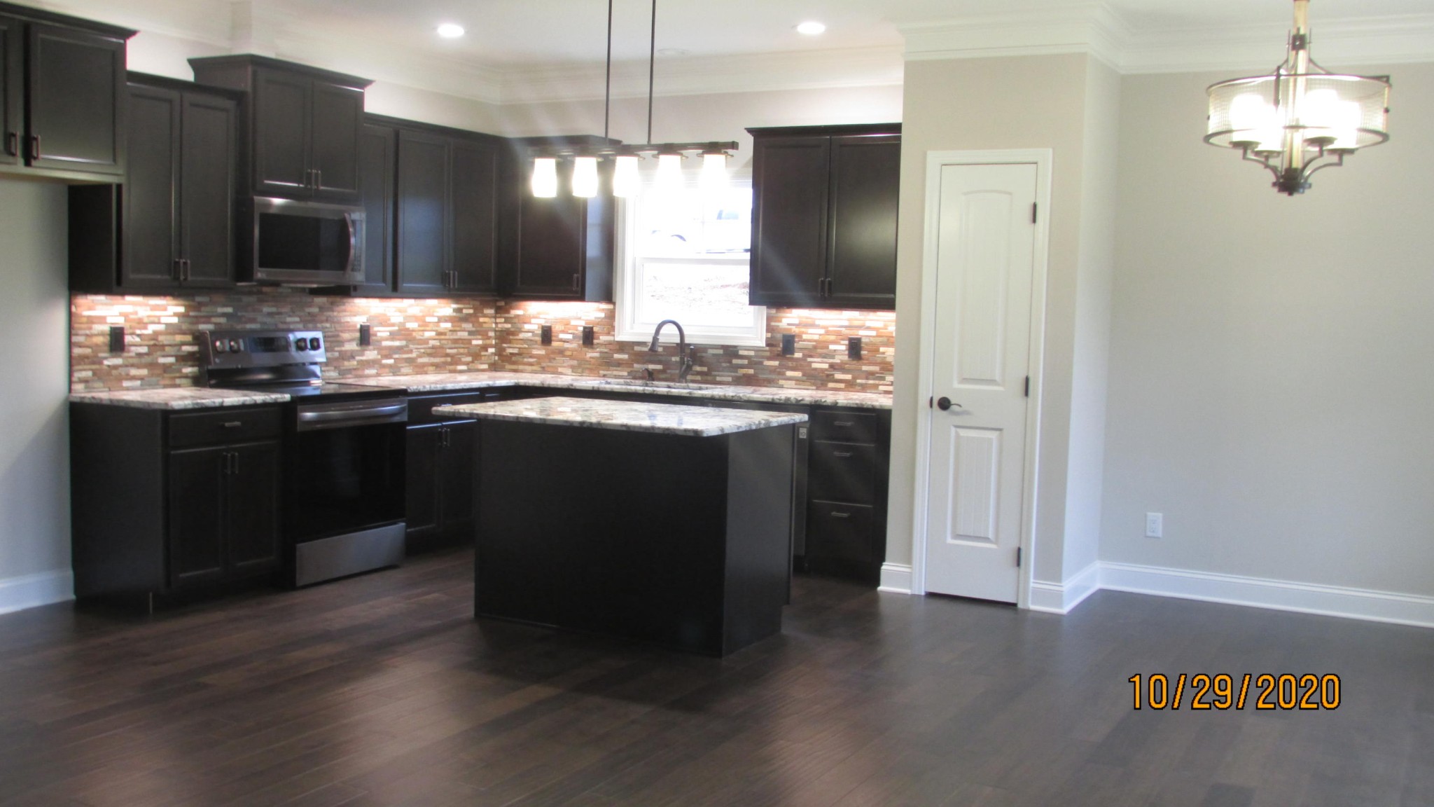 245 South Springview Road Maryville, TN 37801 - Photo 3 of 8 a kitchen with granite countertop a sink cabinets and stainless steel appliances