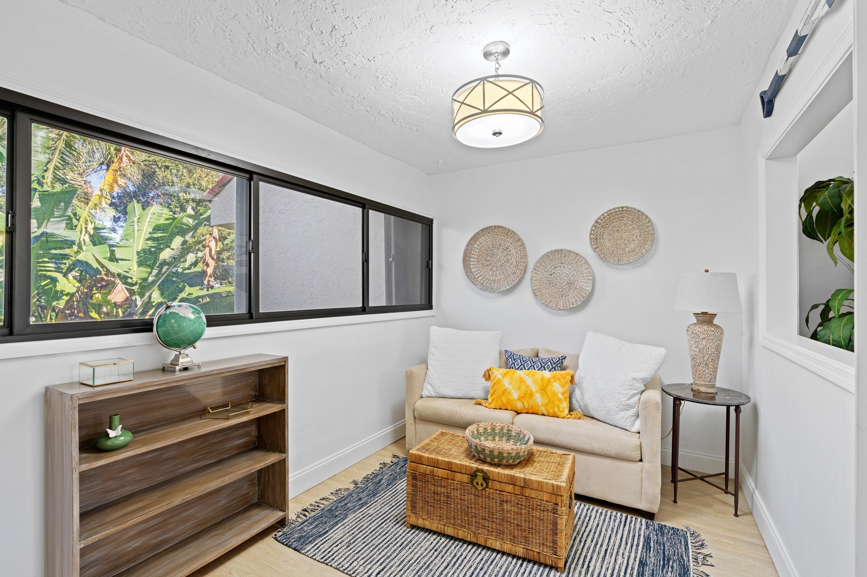 202 Sea Oats Drive Juno Beach, FL 33408 - Photo 12 of 17 a living room with furniture and wooden floor