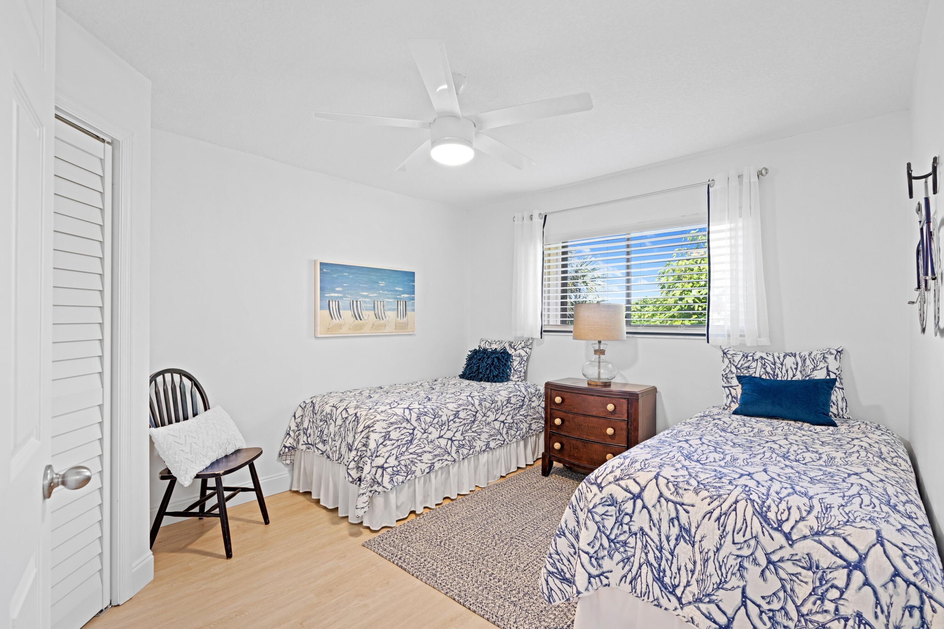 202 Sea Oats Drive Juno Beach, FL 33408 - Photo 16 of 17 a bedroom with two beds and a window
