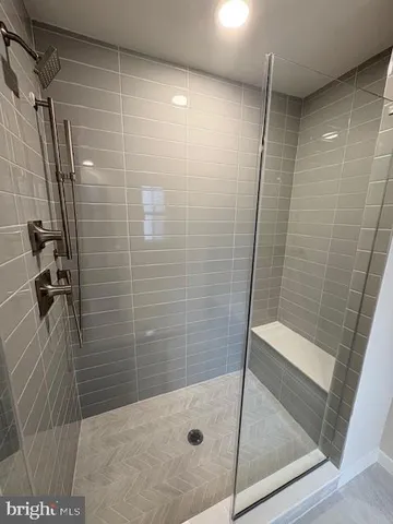 a bathroom with a shower and toilet