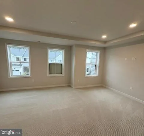 a view of an empty room with windows