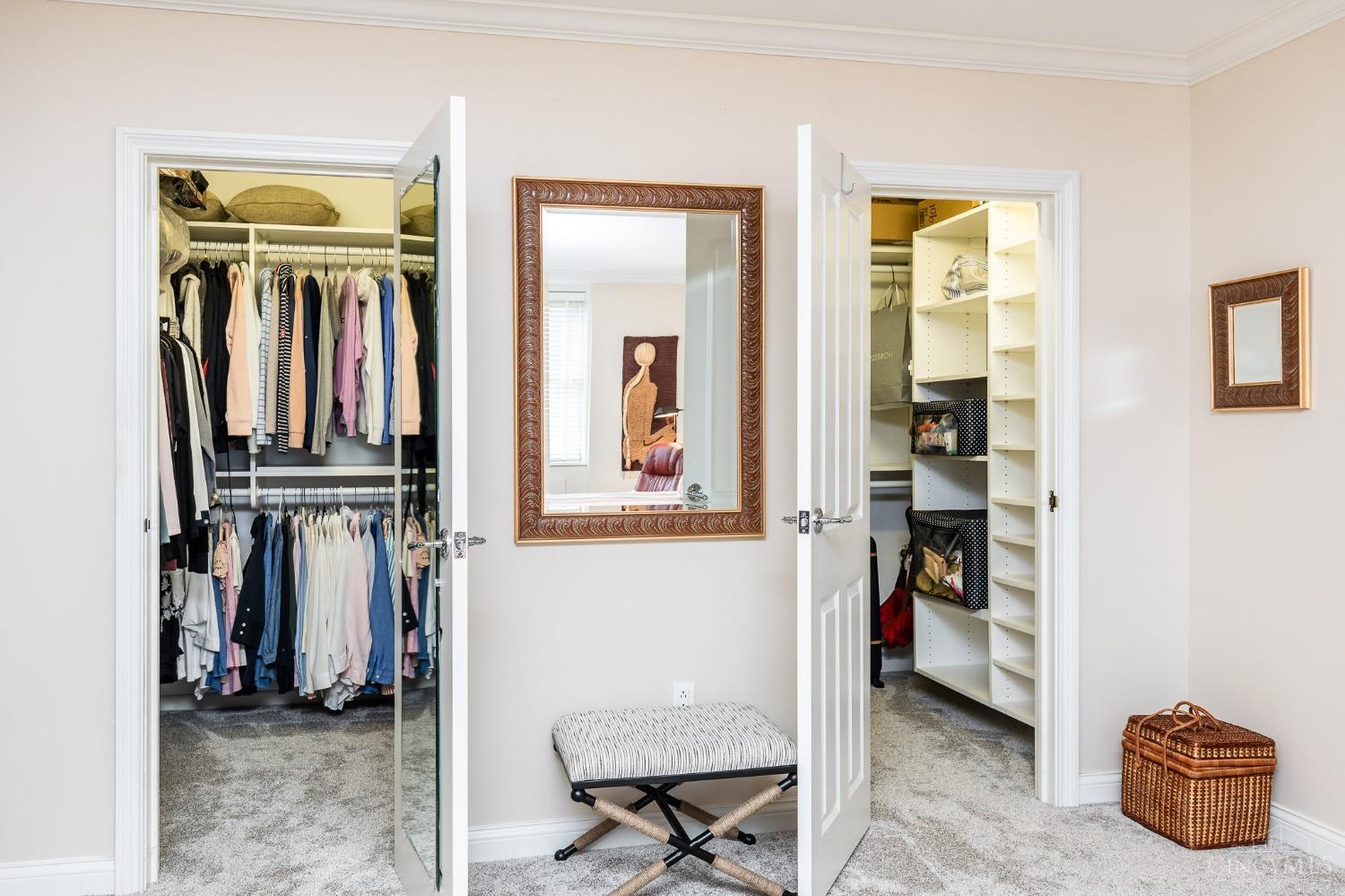 2444 Madison Road, Unit 901 Cincinnati, OH 45208 - Photo 20 of 44 The expansive owner's suite boasts a large bedroom with wall-to-wall carpet, a dressing area, two sizable walk-in closets and an ensuite bath.