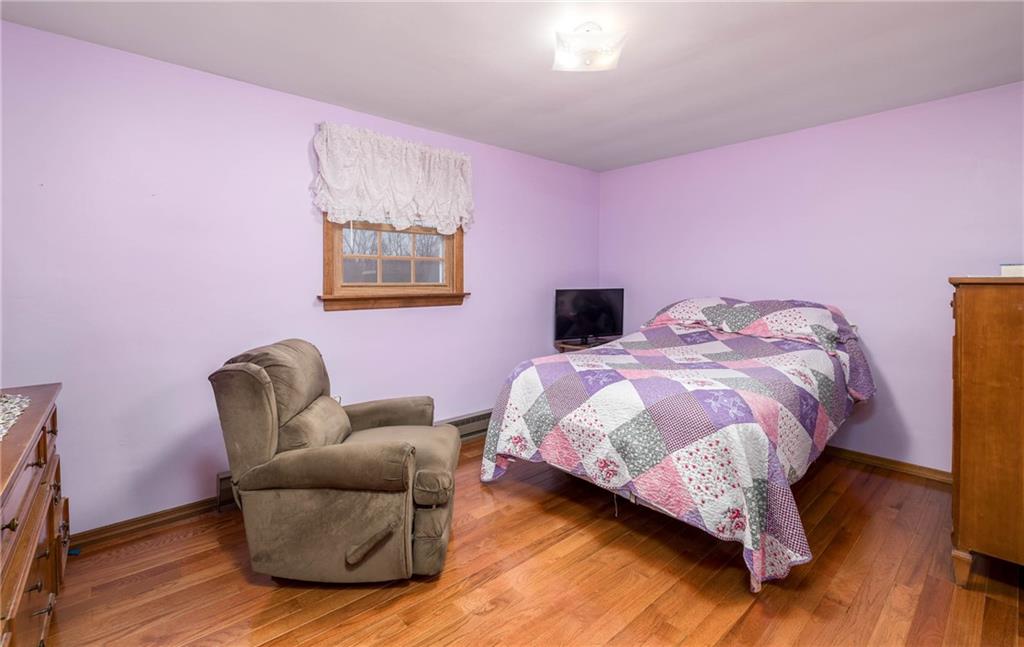 480 Alamae Lakes Road Washington, PA 15301 - Photo 13 of 20 a bedroom with pink walls and a bed