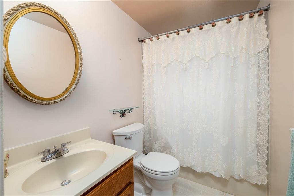 480 Alamae Lakes Road Washington, PA 15301 - Photo 17 of 20 a bathroom with a sink and a mirror