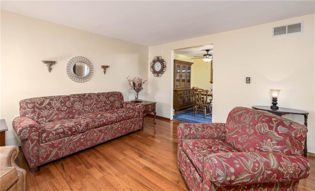 480 Alamae Lakes Road Washington, PA 15301 - Photo 9 of 20 a bedroom with a bed and dresser with wooden floor
