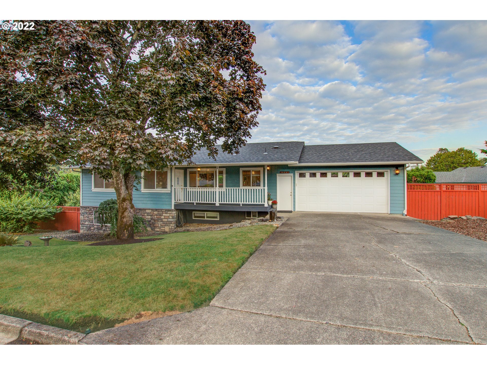 16221 Northeast 33rd Avenue Ridgefield, WA 98642 - Photo 1 of 32 a front view of a house with a yard and garage