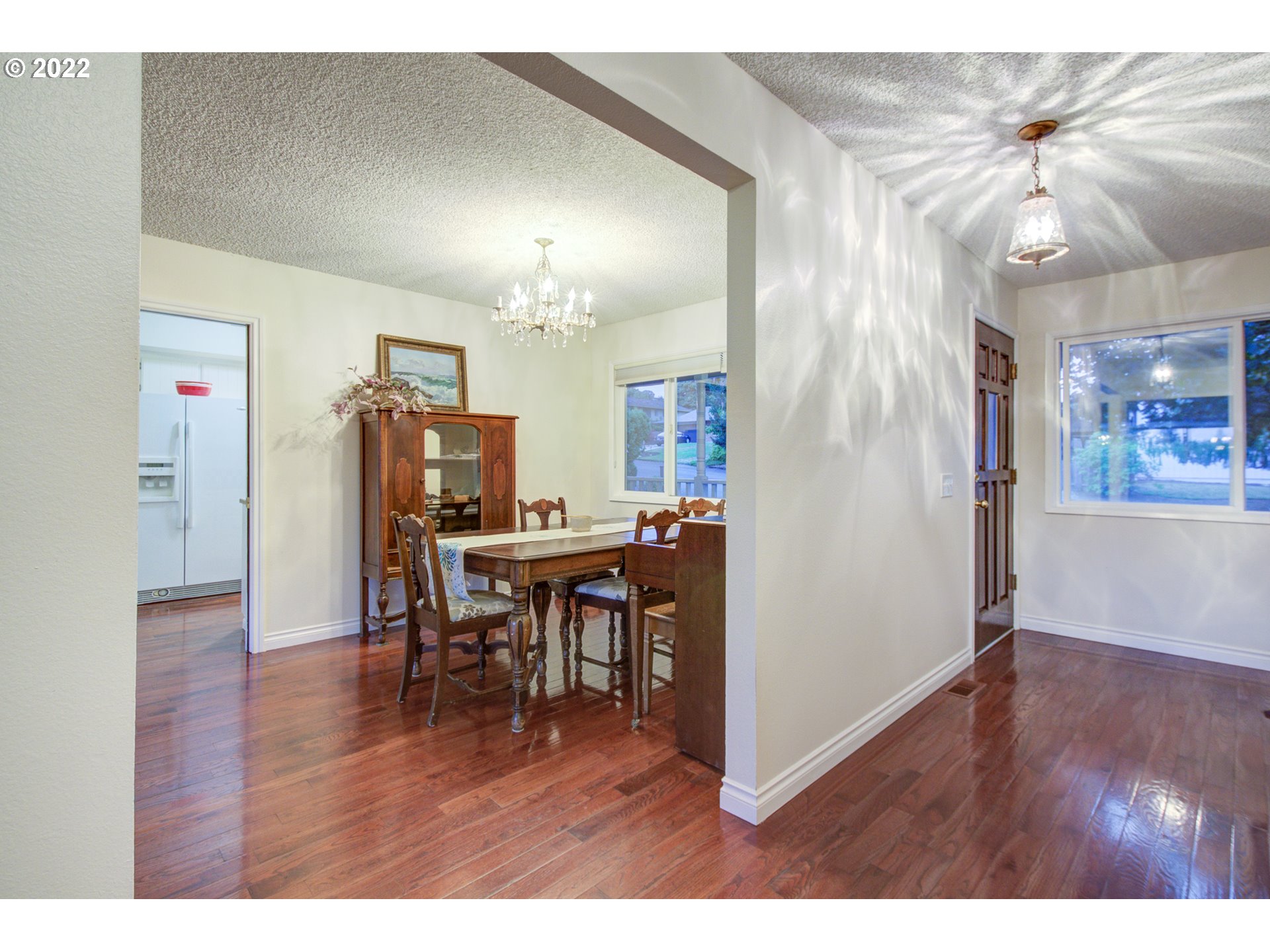 16221 Northeast 33rd Avenue Ridgefield, WA 98642 - Photo 5 of 32 a view of a dining room with furniture and wooden floor