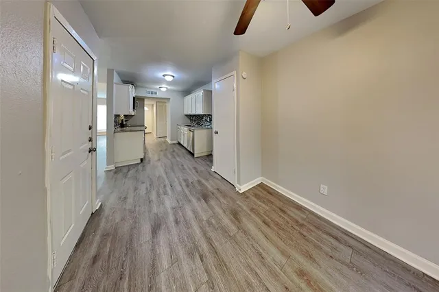 a view of a kitchen from the hallway