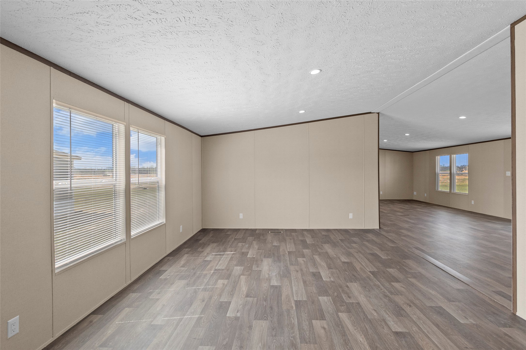 1235 Peter Pne Street Huffman, TX 77336 - Photo 2 of 25 a view of empty room with wooden floor and fan