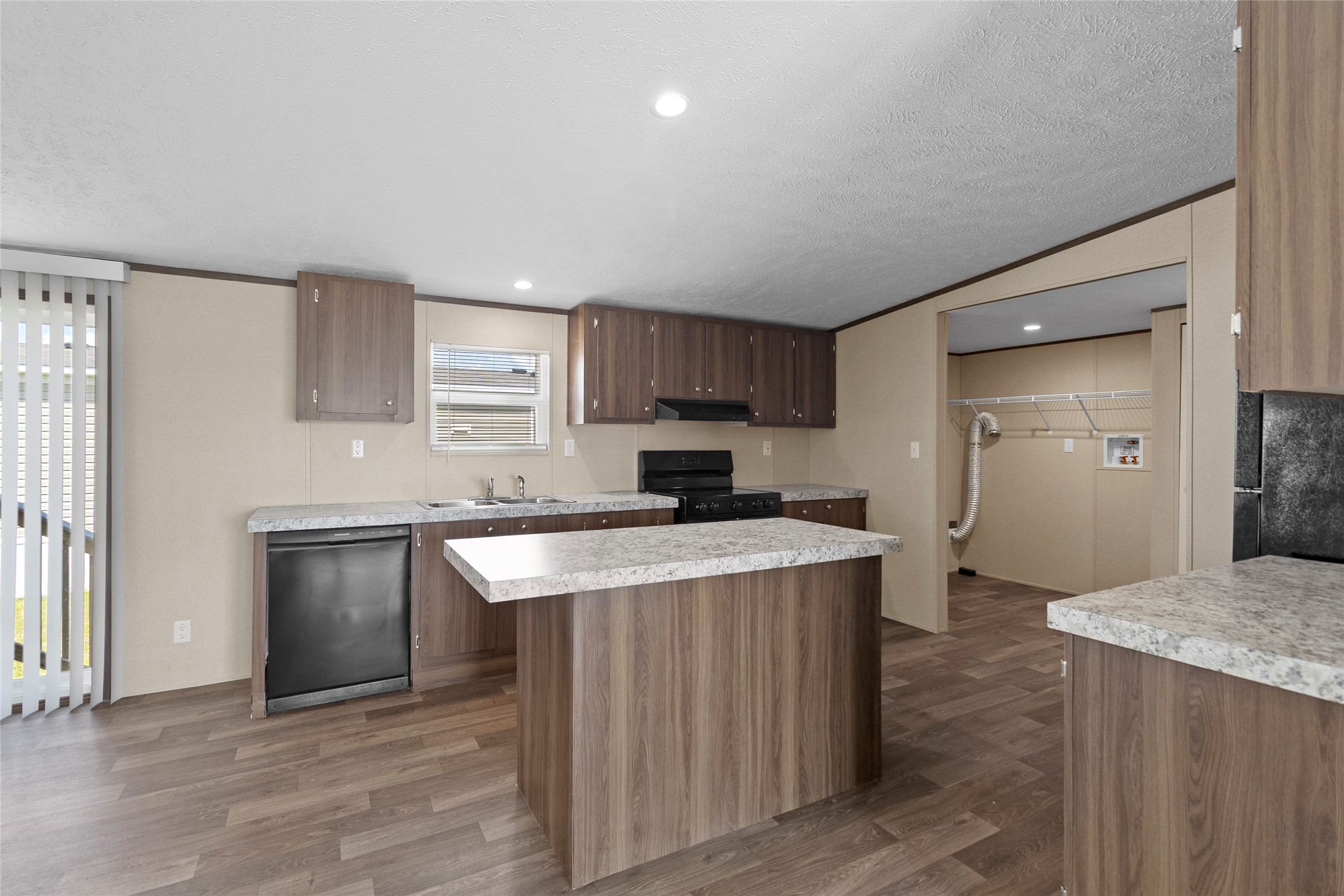 1235 Peter Pne Street Huffman, TX 77336 - Photo 4 of 25 a kitchen with a stove a sink and a refrigerator