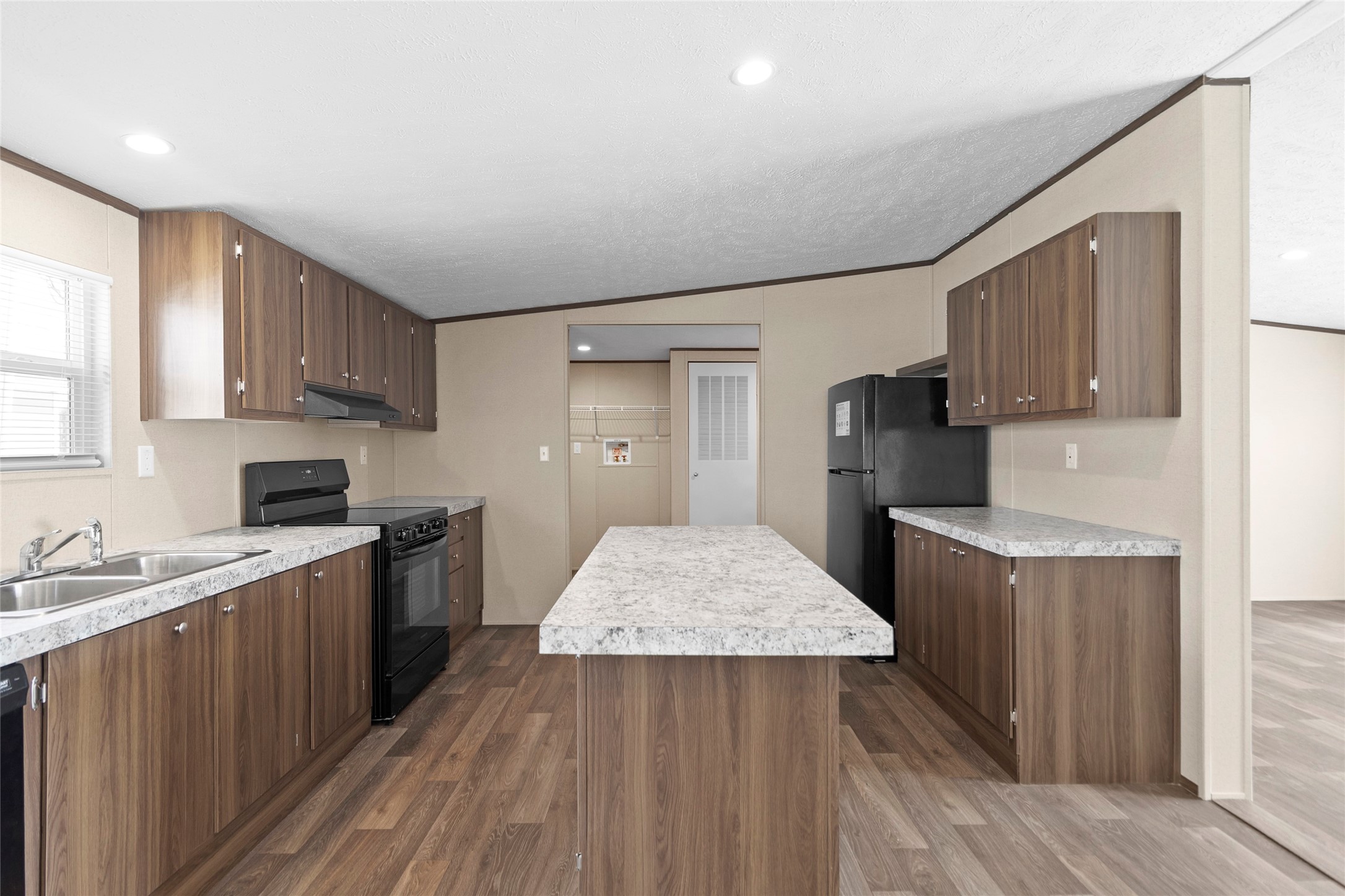 1235 Peter Pne Street Huffman, TX 77336 - Photo 5 of 25 a kitchen with a sink stove and refrigerator