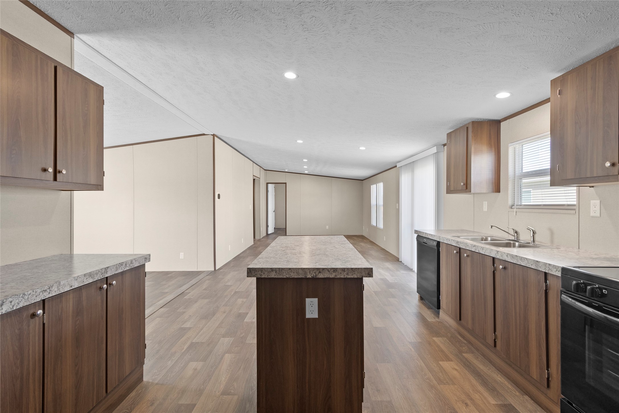 1235 Peter Pne Street Huffman, TX 77336 - Photo 6 of 25 a large kitchen with stainless steel appliances granite countertop a granite counter tops and a stove