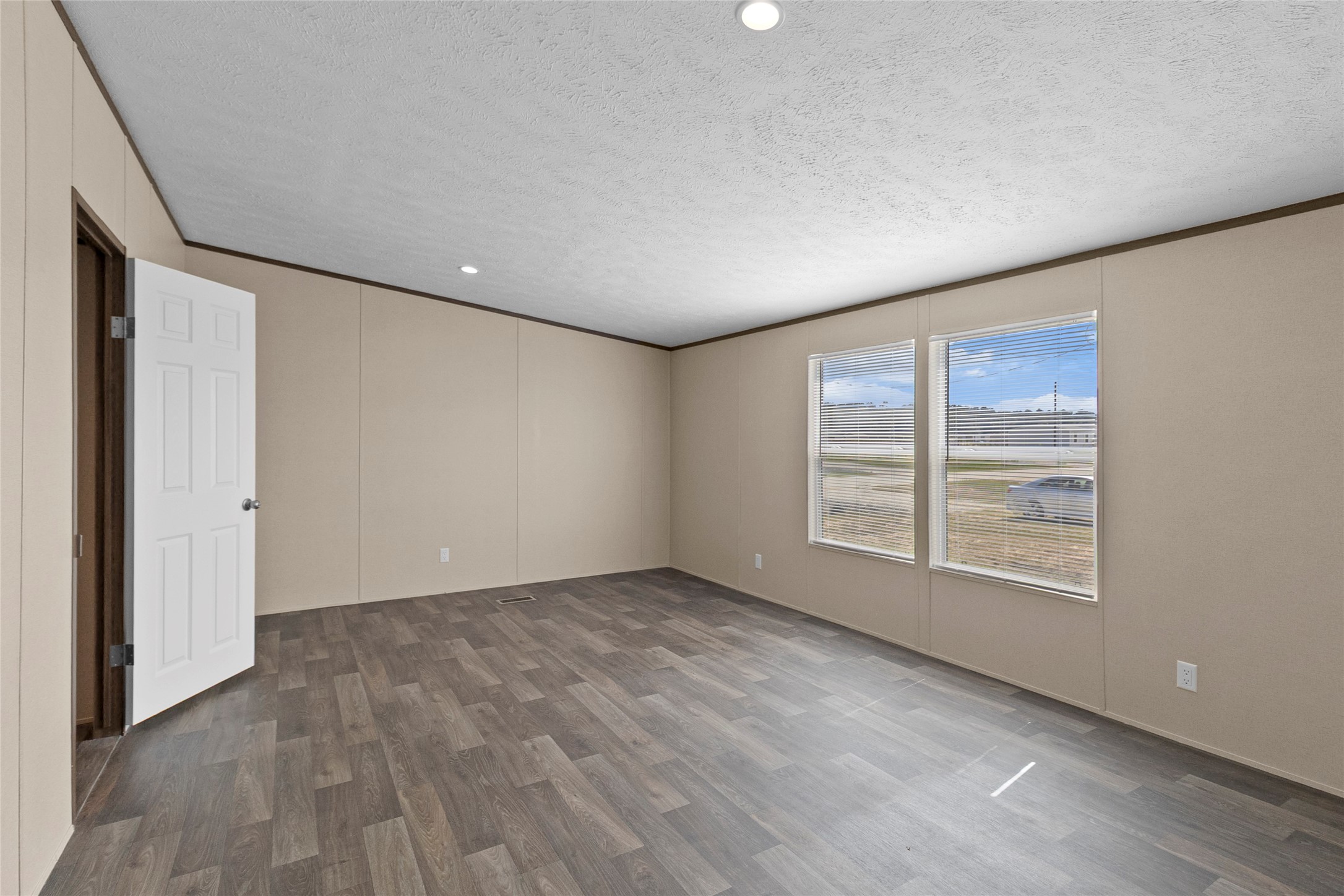 1235 Peter Pne Street Huffman, TX 77336 - Photo 10 of 25 a view of an empty room with a window and wooden floor