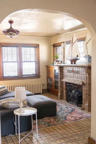 a living room with furniture and a fireplace