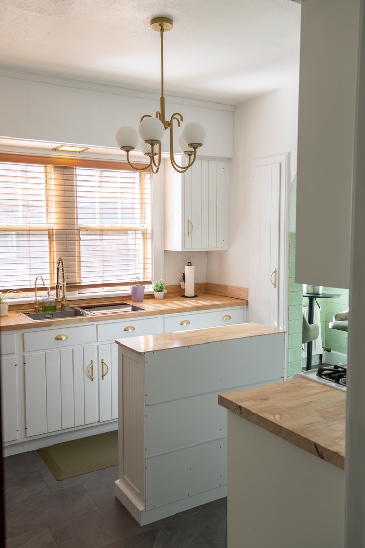 1619 Grant Avenue Rockford, IL 61103 - Photo 6 of 13 a kitchen with a sink stove and window