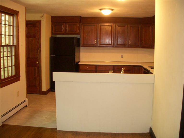 13 Wellfield Road Forestdale, MA 02644 - Photo 8 of 14 a kitchen with a refrigerator and cabinets