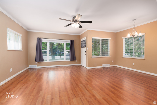 146 West 200 N Street Springville, UT 84663 - Photo 8 of 29 Spacious living area featuring wood-finish flooring, a ceiling fan, and multiple windows with blinds