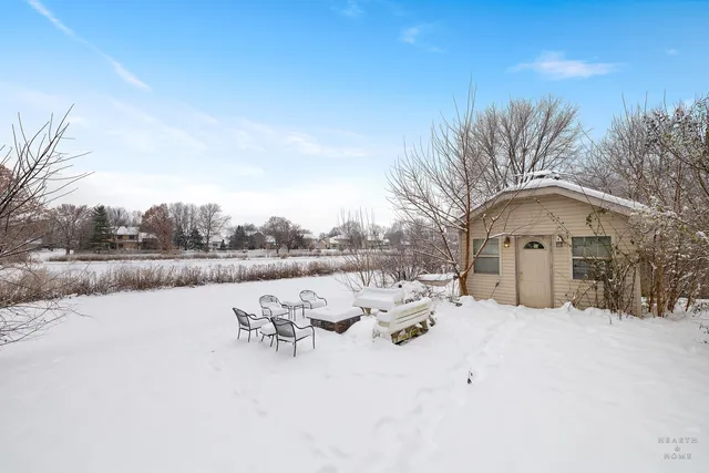 a view of a bench in snow