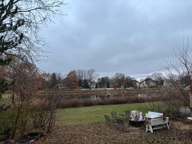 a view of a lake with houses in the back