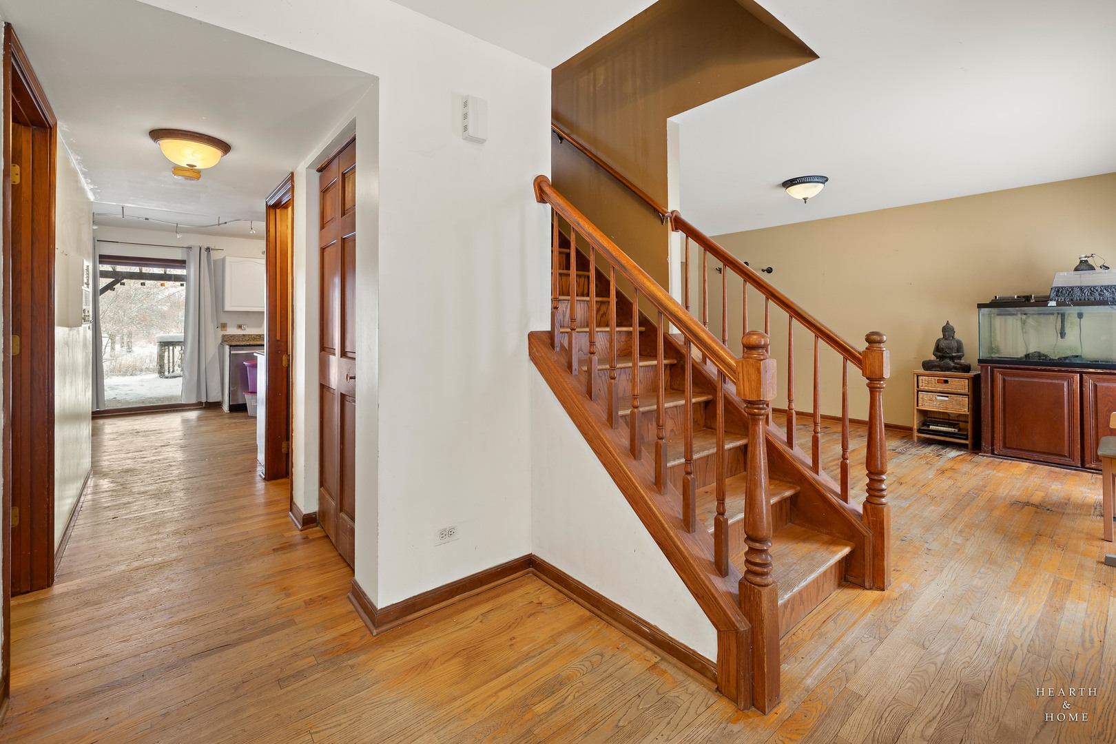 1207 Quail Run Avenue Bolingbrook, IL 60490 - Photo 19 of 48 a view of an entryway with wooden floor and stairs