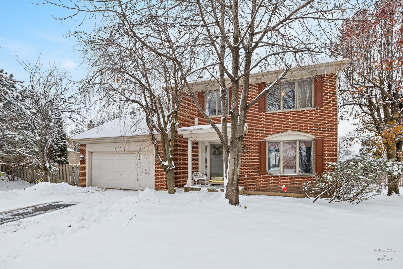 1207 Quail Run Avenue Bolingbrook, IL 60490 - Photo 2 of 48 a front view of a house with a yard and garage