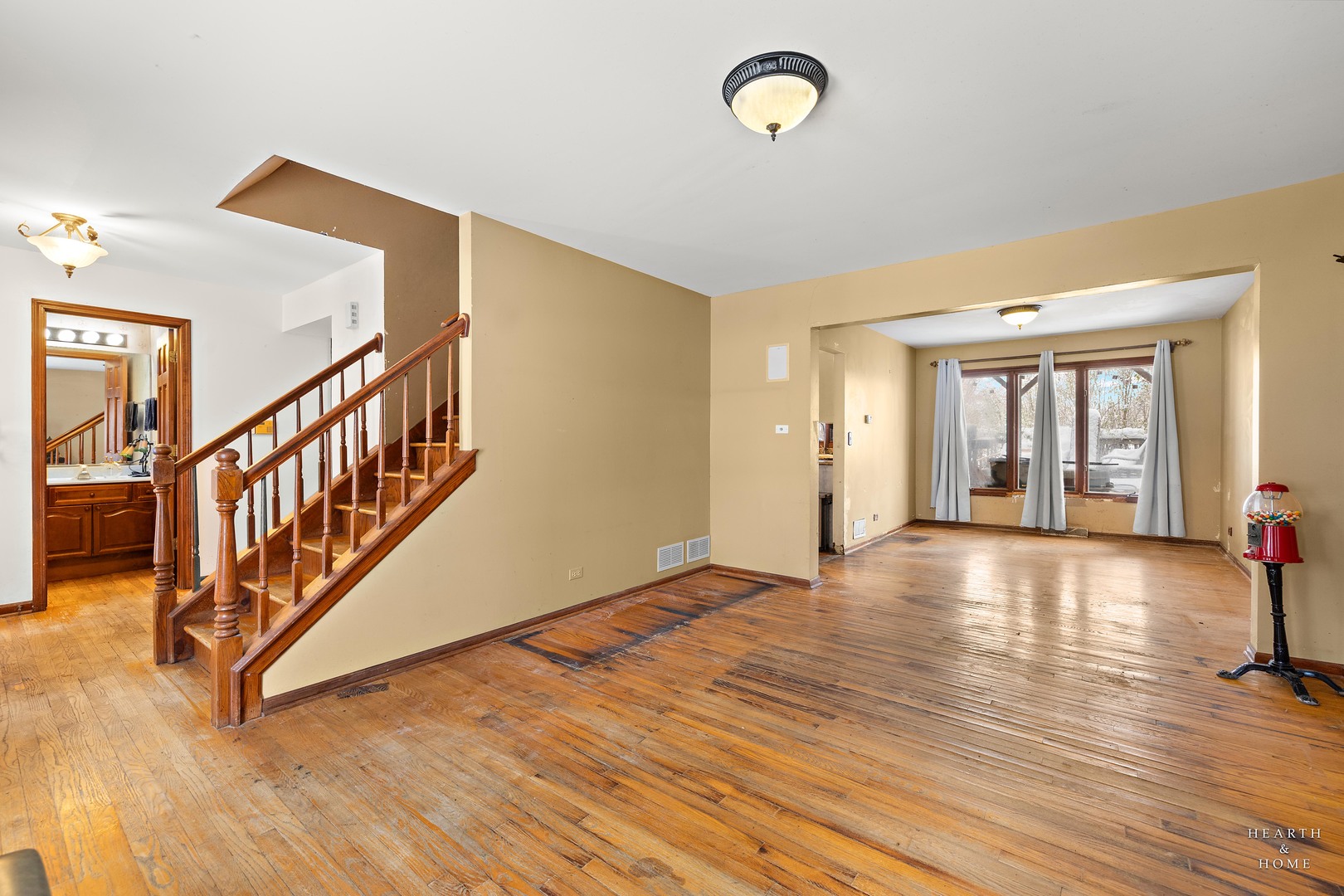 1207 Quail Run Avenue Bolingbrook, IL 60490 - Photo 22 of 48 a view of an empty room with wooden floor and a window