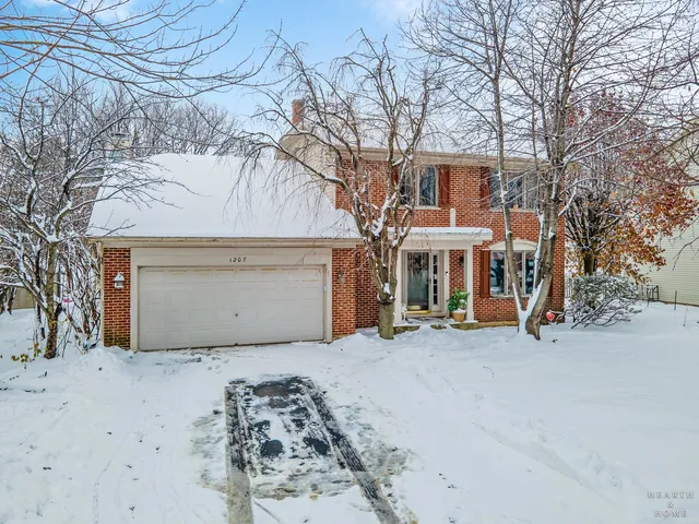 a view of a house with a snow in front of house