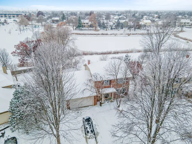 a view of a terrace with chairs and lake view