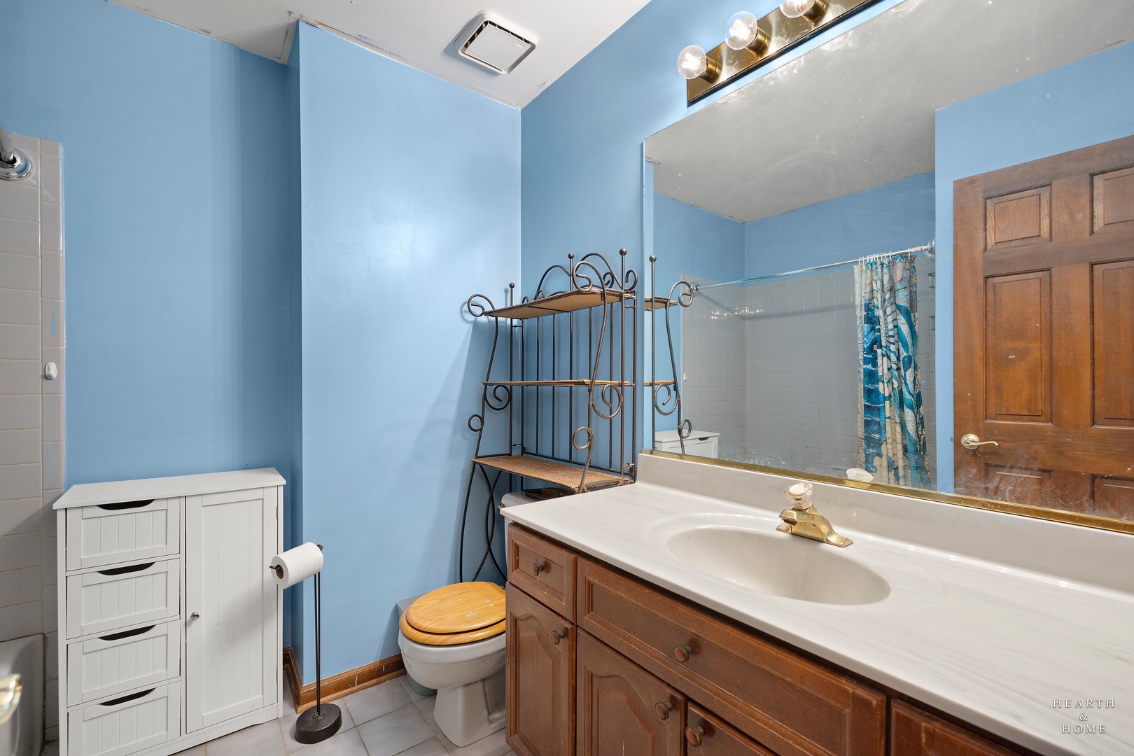 1207 Quail Run Avenue Bolingbrook, IL 60490 - Photo 41 of 48 a bathroom with a sink a toilet and a mirror