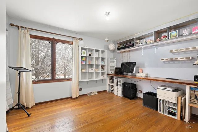a room with furniture pool table and window