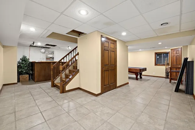 a room with furniture and pool table