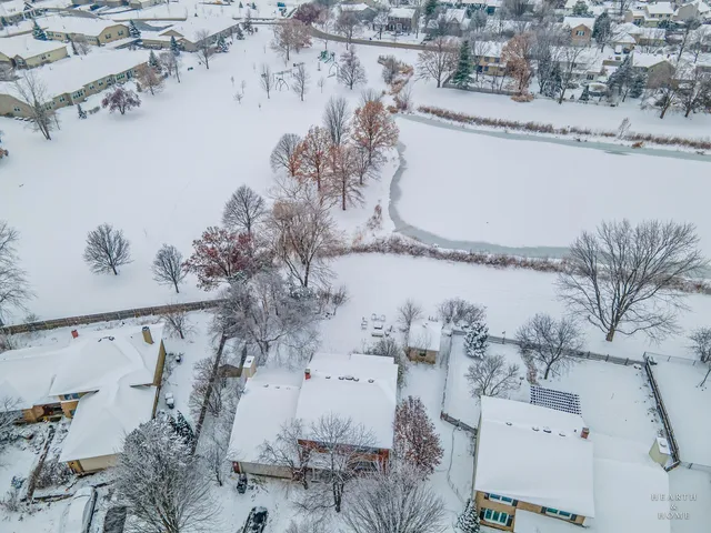 a view of a house with a snow in the yard