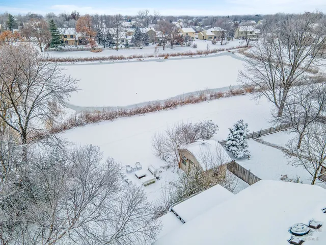 a view of a patio with a wooden fence