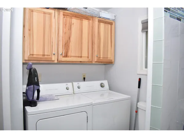 a utility room with dryer and washer
