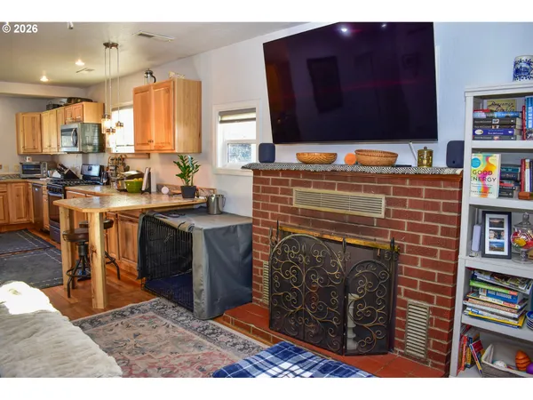 a kitchen with stainless steel appliances kitchen island granite countertop a stove and a sink