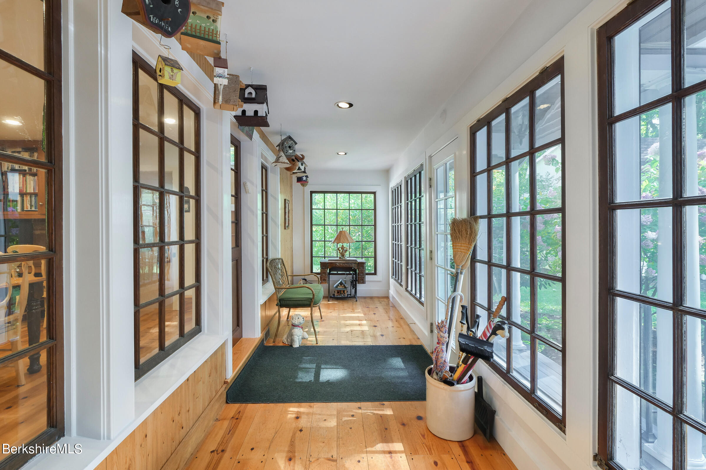 67 Fairview Road Monterey, MA 01245 - Photo 13 of 27 a view of an entryway with wooden floor and a potted plant