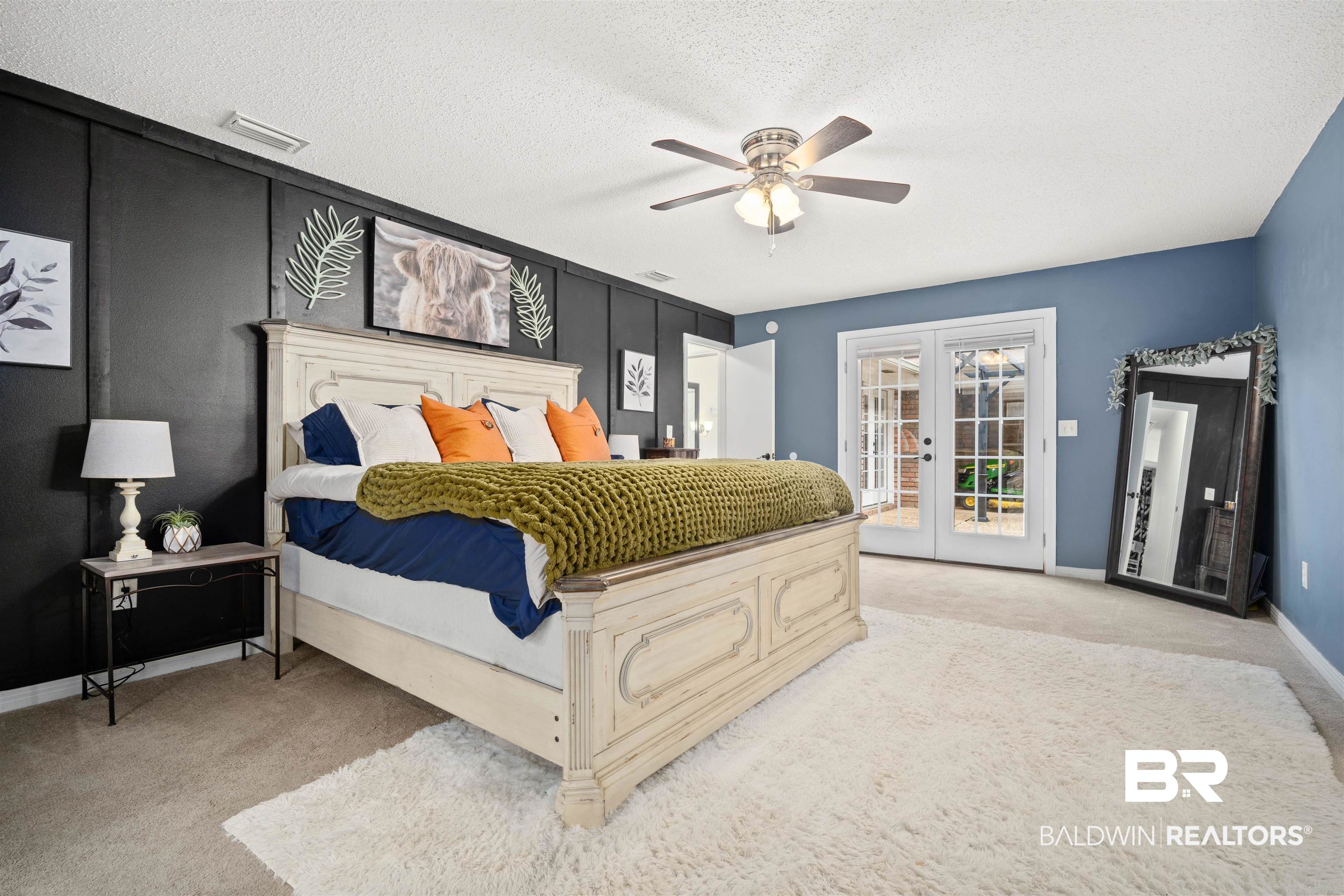 7807 Yorkhaven Road Mobile, AL 36695 - Photo 12 of 34 Bedroom featuring access to exterior, ceiling fan, light carpet, french doors, and a textured ceiling