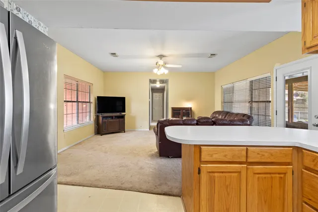 a spacious bathroom with a granite countertop sink and a mirror