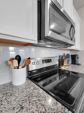 a kitchen with a stove and a microwave