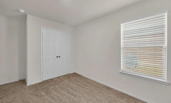 a view of a room that has a window in it
