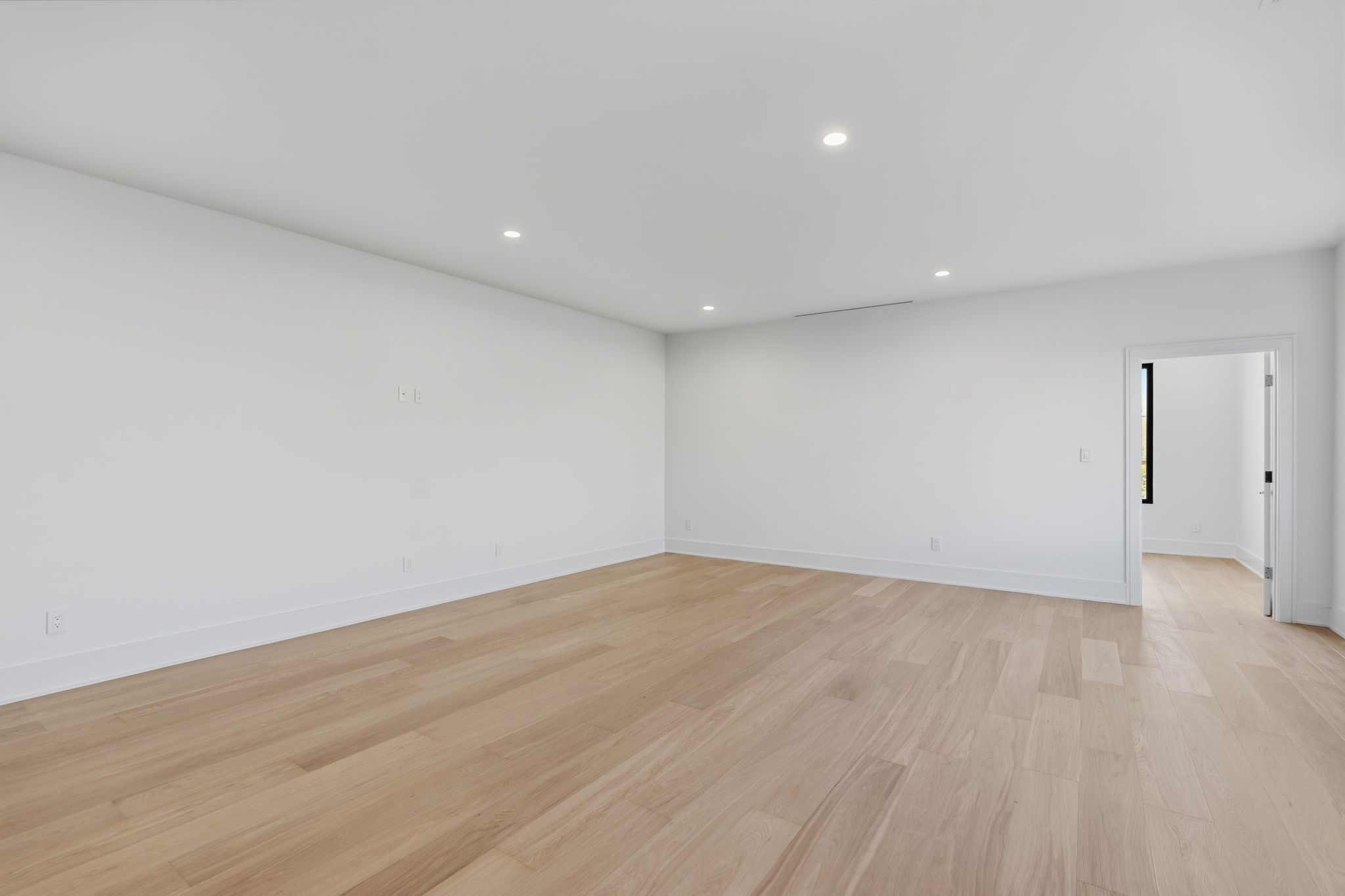 820 Malone Street Houston, TX 77007 - Photo 23 of 31 a view of an empty room with wooden floor and a window
