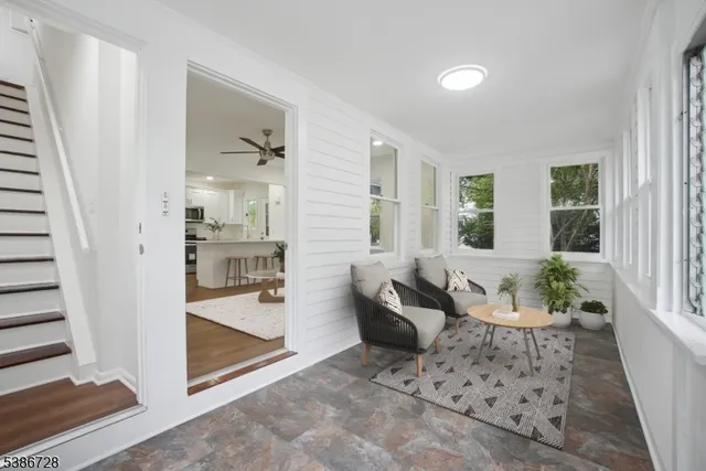 a kitchen with granite countertop a stove a sink and a granite counter top